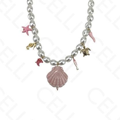 Collar de acero, concha de cerámica y perlas.